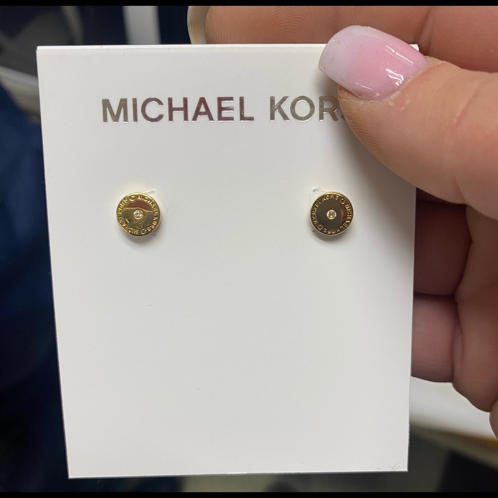 Michael Kors gold stud earrings.